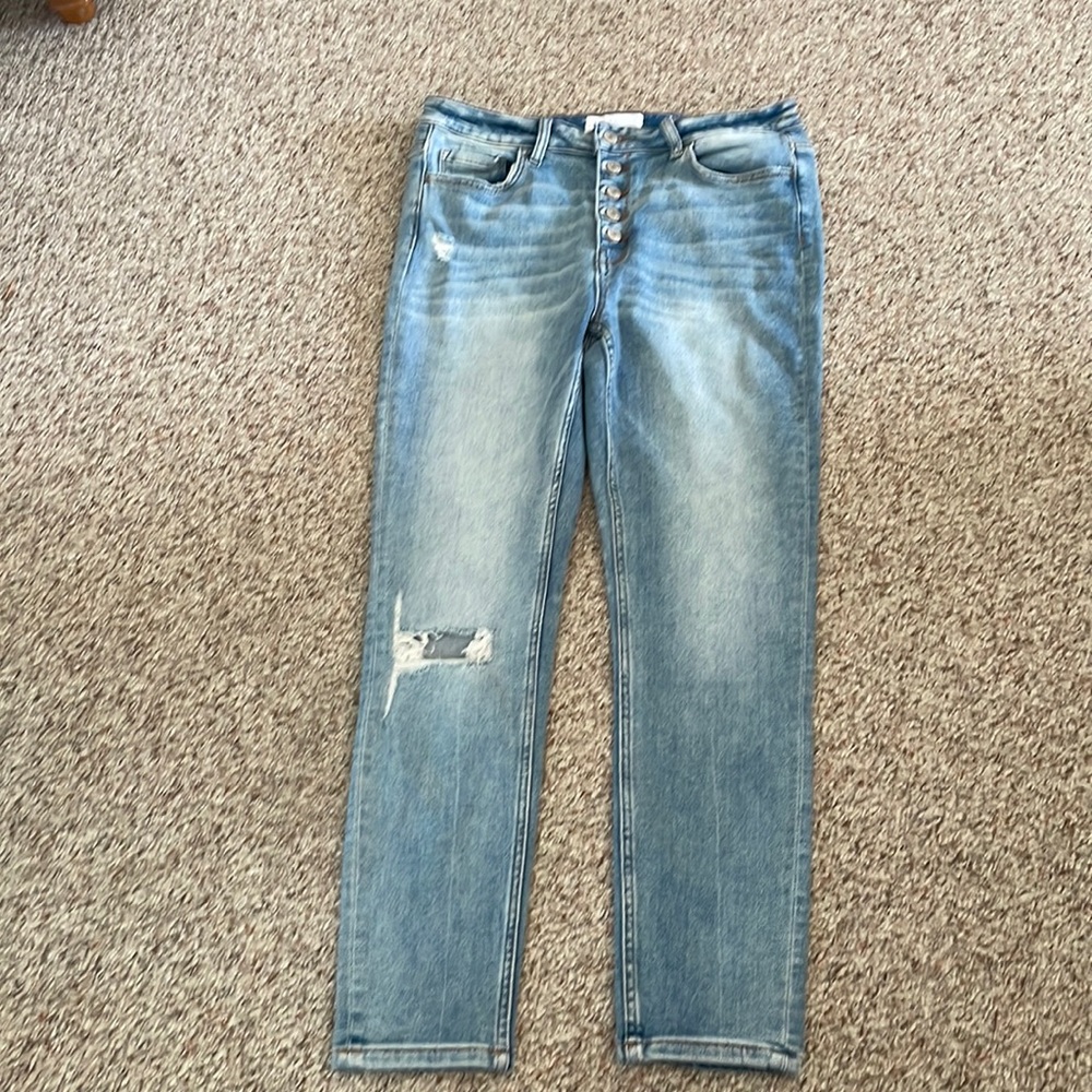 Light distressed & ripped blue jeans. Brand new, never worn